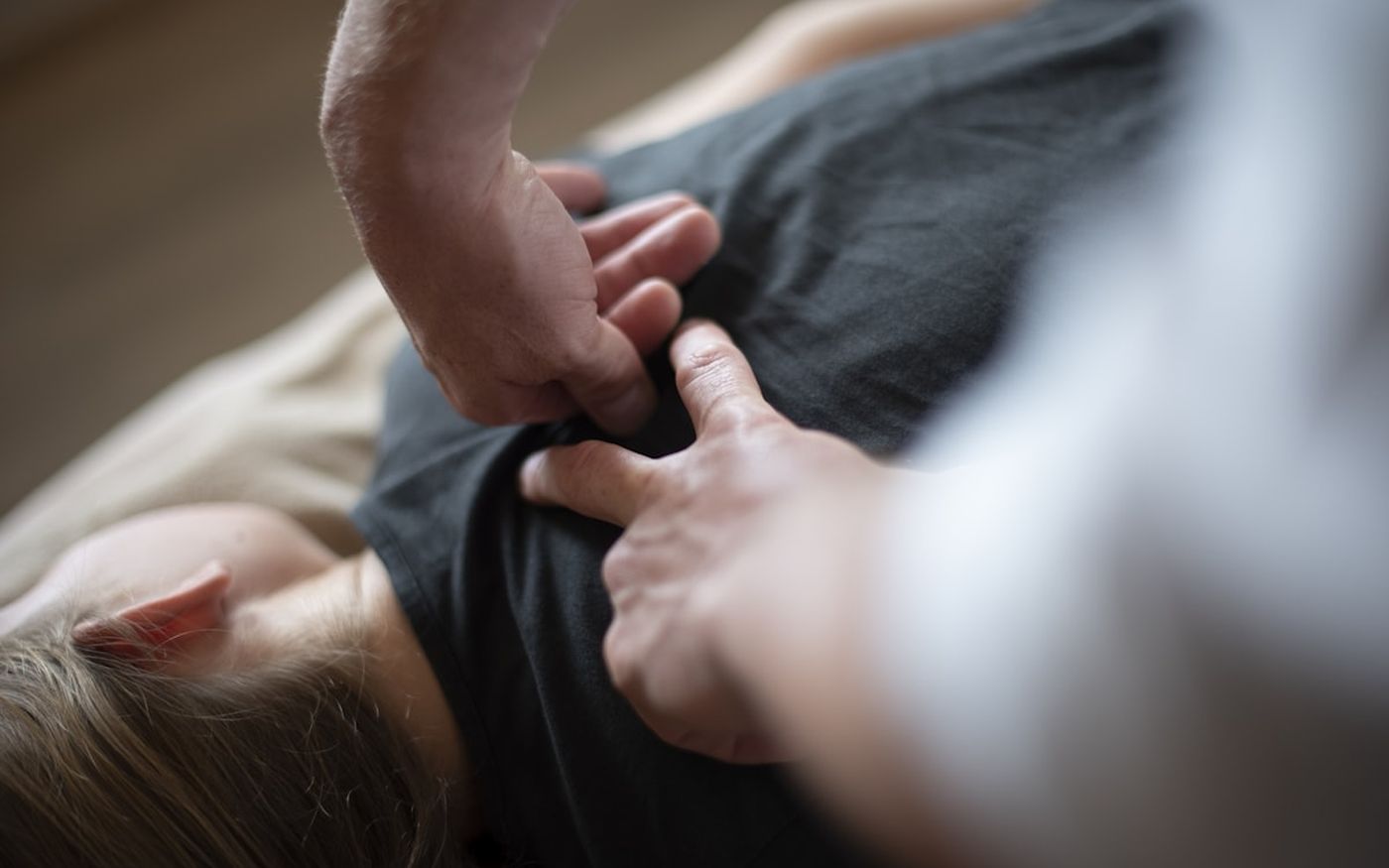 Close-up of a gentle, hands-on chiropractic adjustment