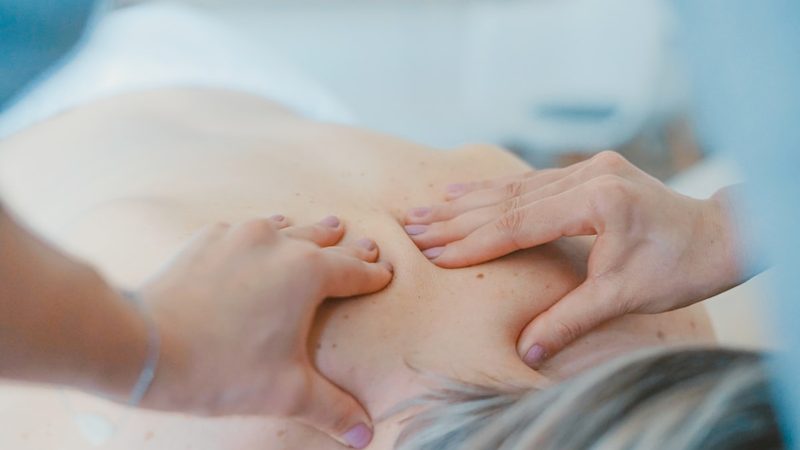 A close-up of hands-on soft tissue therapy