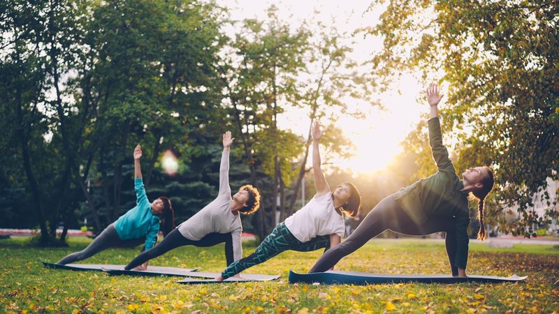 A group taking part in an outdoor wellness class